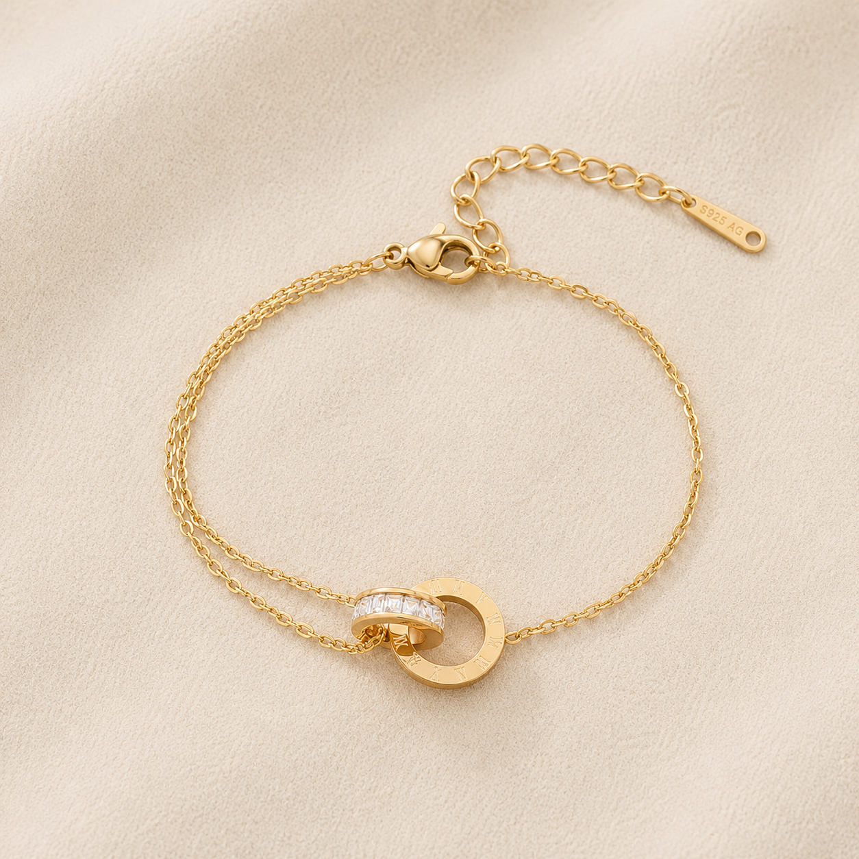 Maison Élyséa Amélie gold bracelet featuring Roman numeral circle charms and sparkling white zircon stones