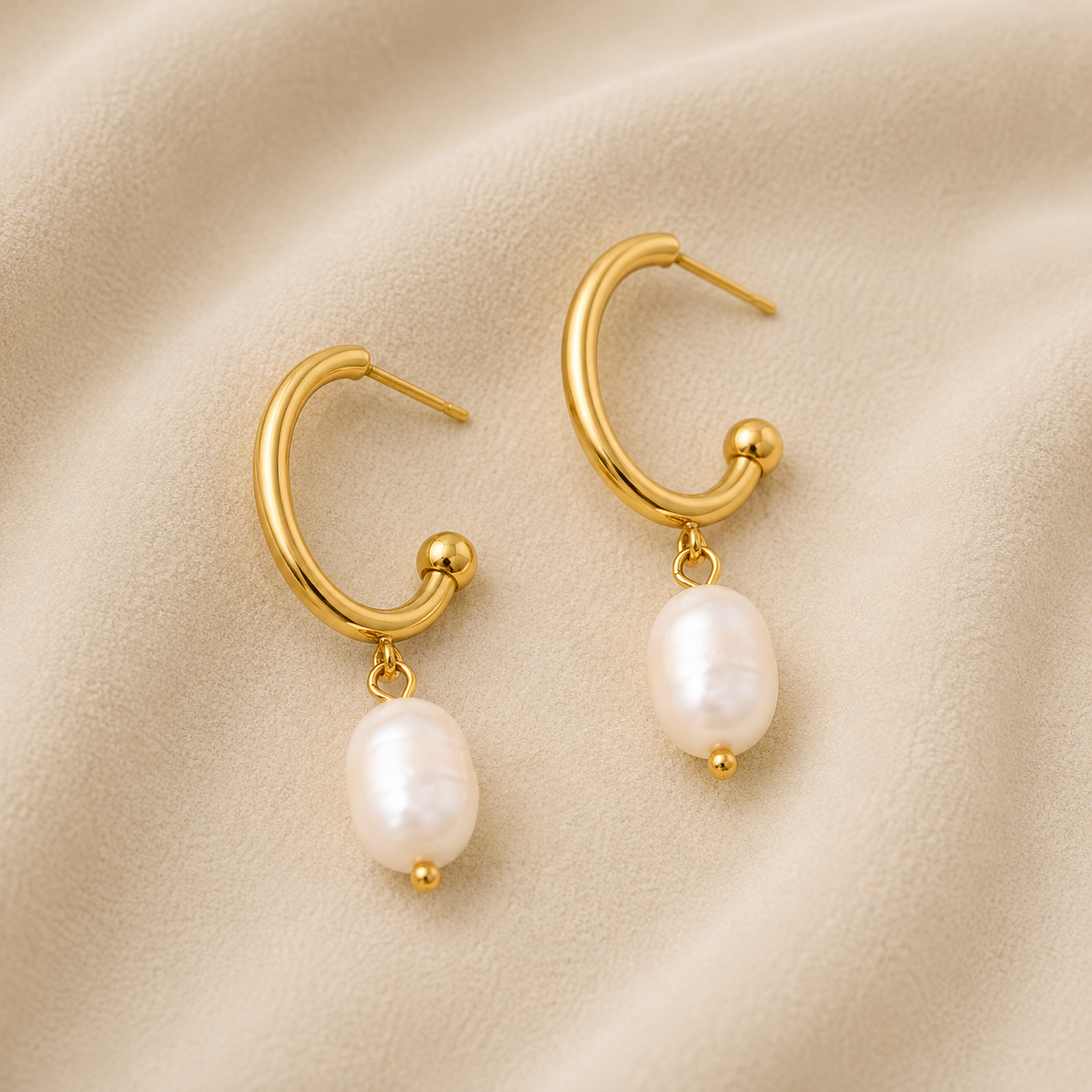 Daphne Gold Pearl Earrings with genuine freshwater pearl drops and waterproof 18K gold PVD stainless steel hoop design by Maison Élyséa.