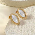 Margaux Gold Earrings featuring pearl-effect marquise stones with textured gold detailing