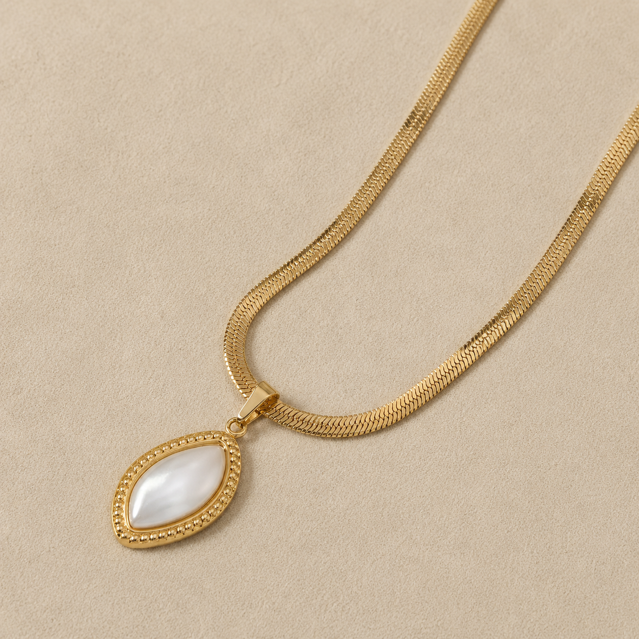 Elegant gold necklace with pearl-inspired pendant by Maison Élyséa