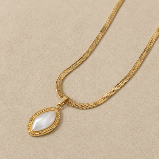 Elegant gold necklace with pearl-inspired pendant by Maison Élyséa